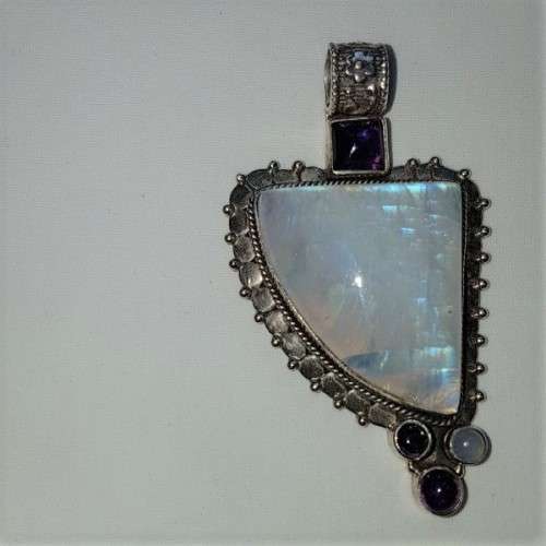A stunning antique sterling silver pendant with a large clear Topaz and smokey Amethyst stones