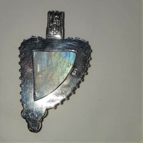 A stunning antique sterling silver pendant with a large clear Topaz and smokey Amethyst stones