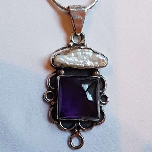 A beautiful sterling silver pendant w/ a large square Amethyst stone & baroque pearl on a chain