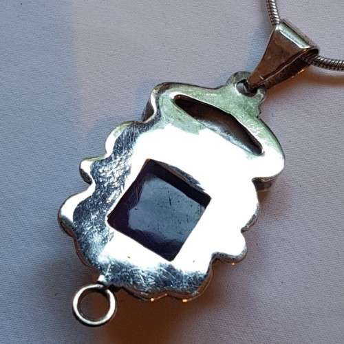 A beautiful sterling silver pendant w/ a large square Amethyst stone & baroque pearl on a chain