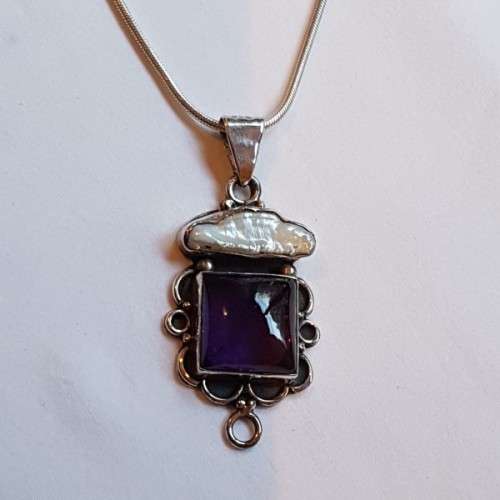A beautiful sterling silver pendant w/ a large square Amethyst stone & baroque pearl on a chain