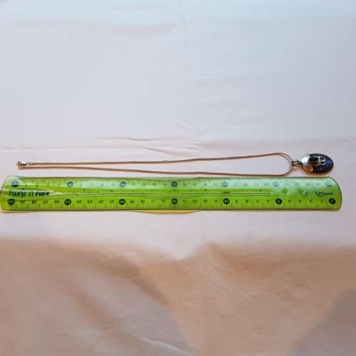 A beautiful sterling silver pendant w/ a large square Amethyst stone & baroque pearl on a chain