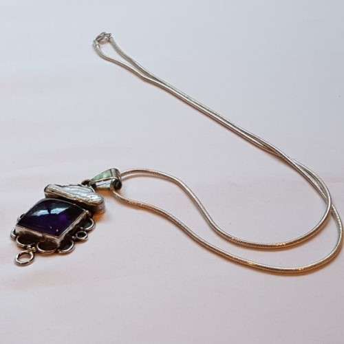 A beautiful sterling silver pendant w/ a large square Amethyst stone & baroque pearl on a chain