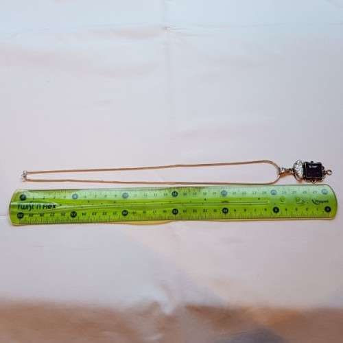 A beautiful sterling silver pendant w/ a large square Amethyst stone & baroque pearl on a chain