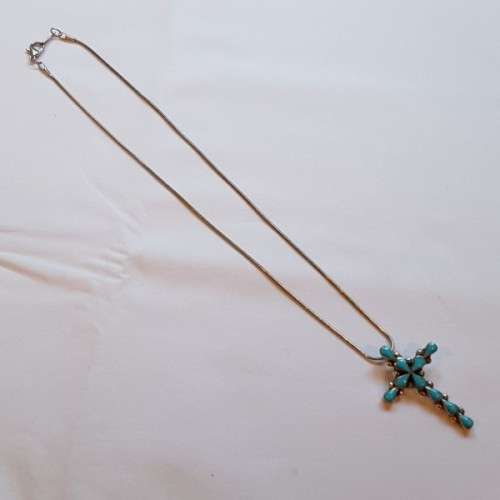 An exquisitely made North American Indian "Turquoise stone" (set in sterling silver) cross pendant