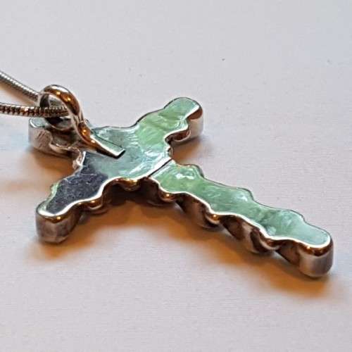 An exquisitely made North American Indian "Turquoise stone" (set in sterling silver) cross pendant