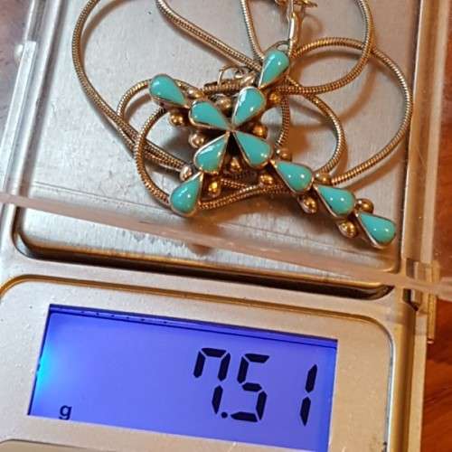 An exquisitely made North American Indian "Turquoise stone" (set in sterling silver) cross pendant