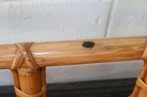 A lovely cane occasional/ coffee table with a removable glass top - stunning in a holiday home