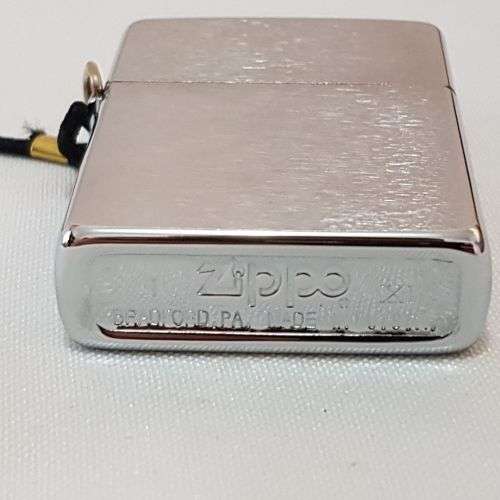 A stunning authentic Zippo "Classic brushed chrome" lighter in excellent condition in original box