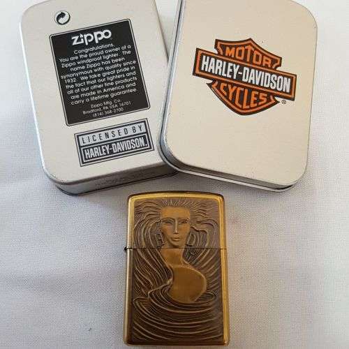 **RS17** An unused solid brass Harley Davidson "Girl with Harley Davidson earrings" Zippo lighter