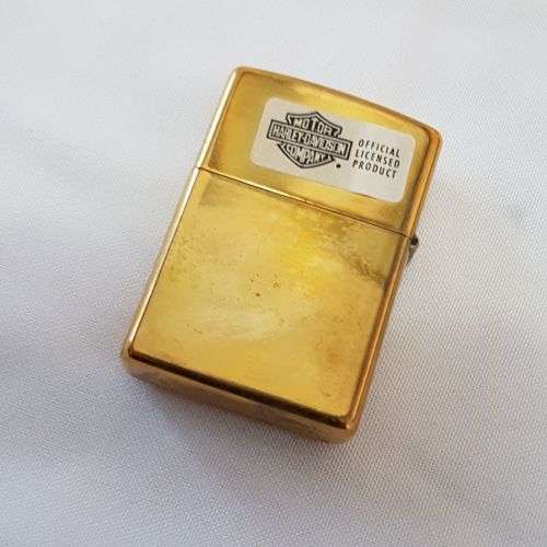 **RS17** An unused solid brass Harley Davidson "Girl with Harley Davidson earrings" Zippo lighter
