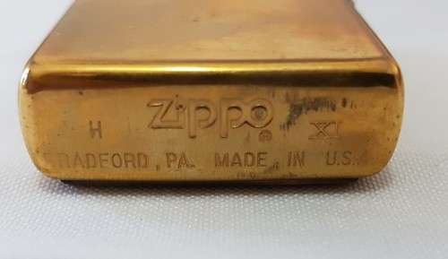 **RS17** An unused solid brass Harley Davidson "Girl with Harley Davidson earrings" Zippo lighter