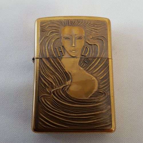 **RS17** An unused solid brass Harley Davidson "Girl with Harley Davidson earrings" Zippo lighter