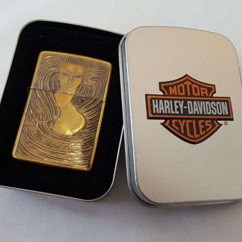 **RS17** An unused solid brass Harley Davidson "Girl with Harley Davidson earrings" Zippo lighter