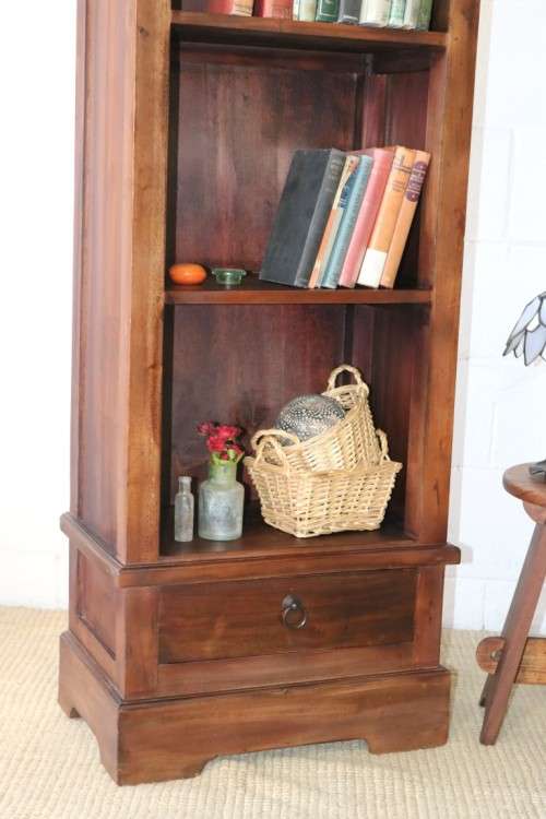 An incredible tall wooden bookcase with three spacious shelves and a bottom drawer - stunning!!