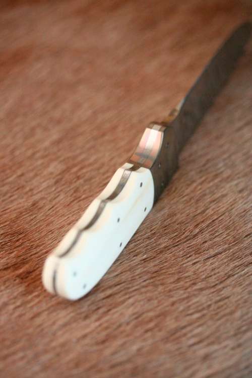 Incredible custom made Mike Skellern Damascus steel & bone handle knife w/ brass embellishments