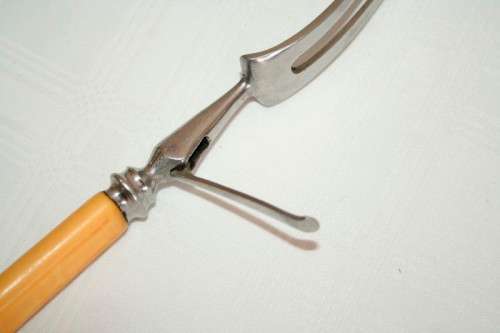 A stunning vintage boxed bone handle style carving knife and fork set with a sharpening steel