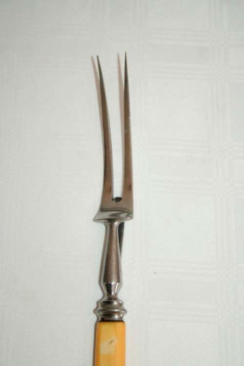 A stunning vintage boxed bone handle style carving knife and fork set with a sharpening steel