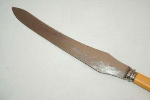 A stunning vintage boxed bone handle style carving knife and fork set with a sharpening steel