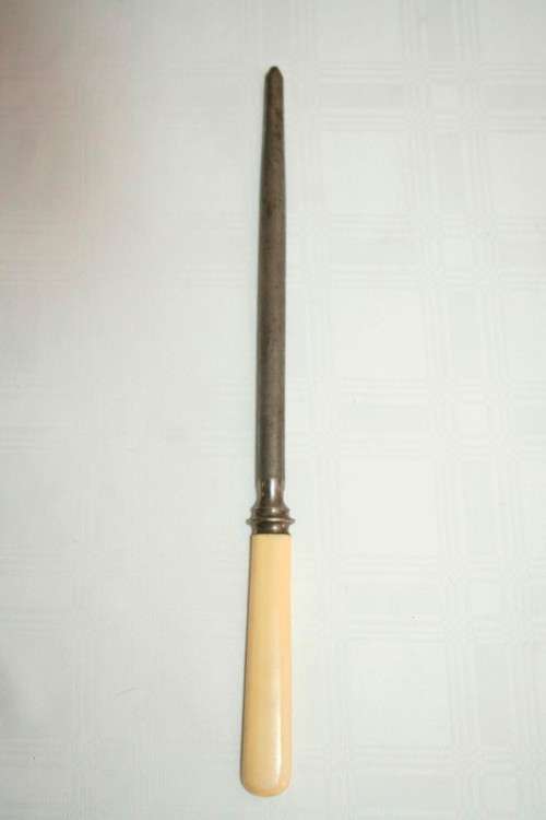 A stunning vintage boxed bone handle style carving knife and fork set with a sharpening steel