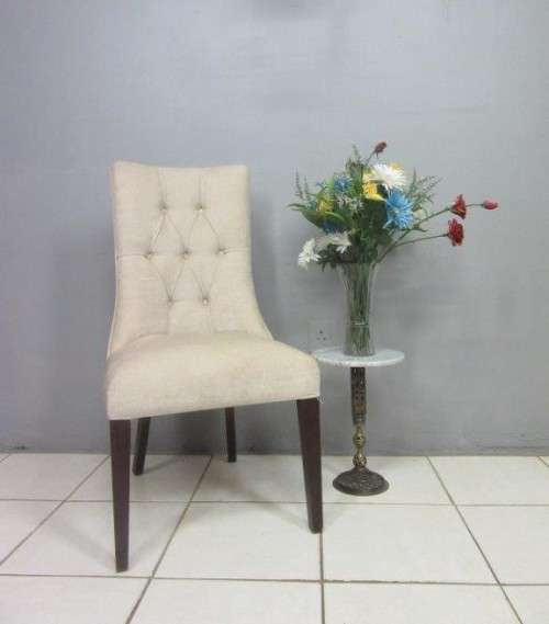 A stylish and beautifully upholstered hi-back occasional chair in a quality linen upholstery fabric
