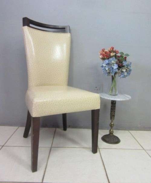 A stunning and extremely stylish high-back occasional chair in a superb patent-leather feel fabric