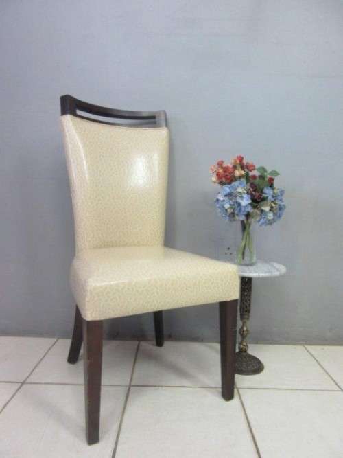A stunning and extremely stylish high-back occasional chair in a superb patent-leather feel fabric