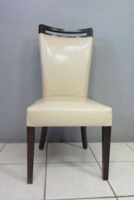 A stunning and extremely stylish high-back occasional chair in a superb patent-leather feel fabric