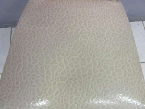 A stunning and extremely stylish high-back occasional chair in a superb patent-leather feel fabric