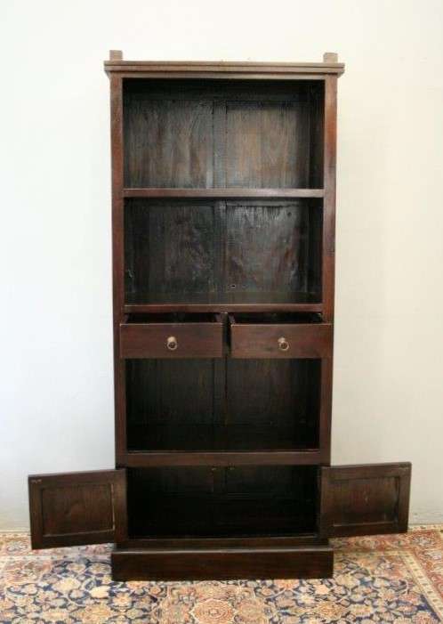 A wonderful tall teak display cabinet/ bookcase with shelves, storage cupboards and drawers