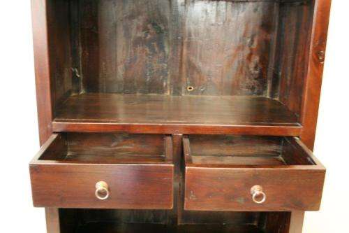 A wonderful tall teak display cabinet/ bookcase with shelves, storage cupboards and drawers
