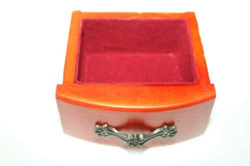 A wonderful wooden upright jewellery box with four drawers, ring slots & a rotating necklace holder