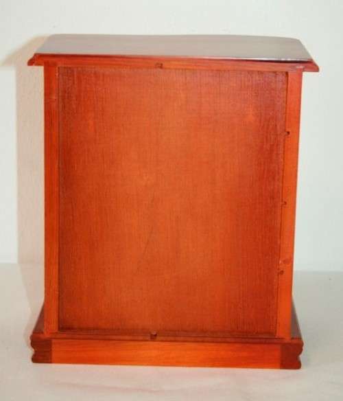 A wonderful wooden upright jewellery box with four drawers, ring slots & a rotating necklace holder