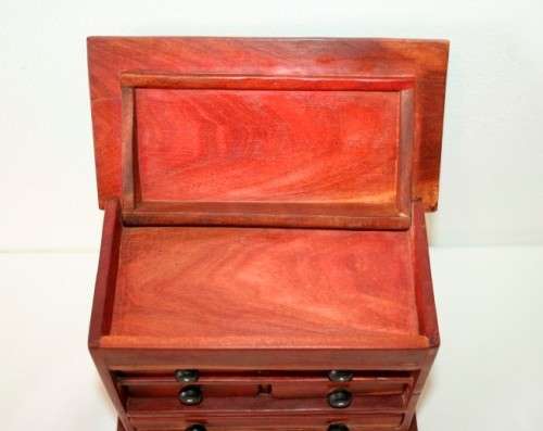 An awesome hand made solid teak jewellery box with six drawers and a storage tray under the lid