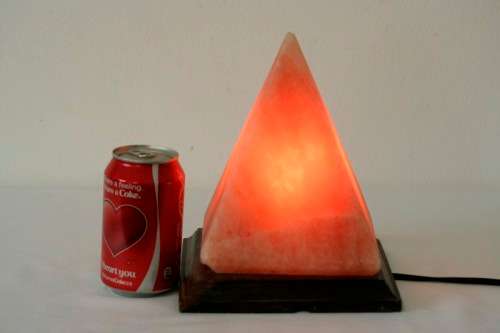 An incredible "Pyramid" Himalayan Crystal Salt lamp on a wooden base in complete working condition
