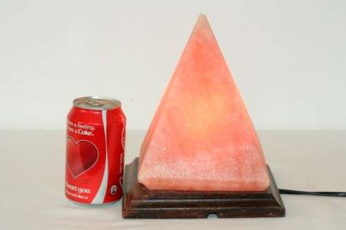 An incredible "Pyramid" Himalayan Crystal Salt lamp on a wooden base in complete working condition
