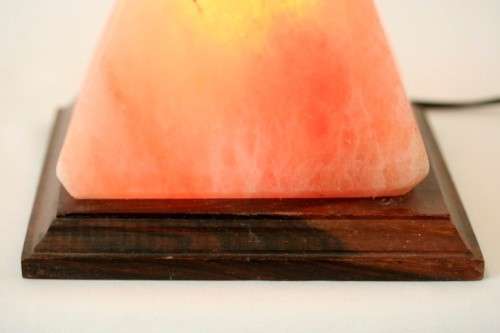 An incredible "Pyramid" Himalayan Crystal Salt lamp on a wooden base in complete working condition