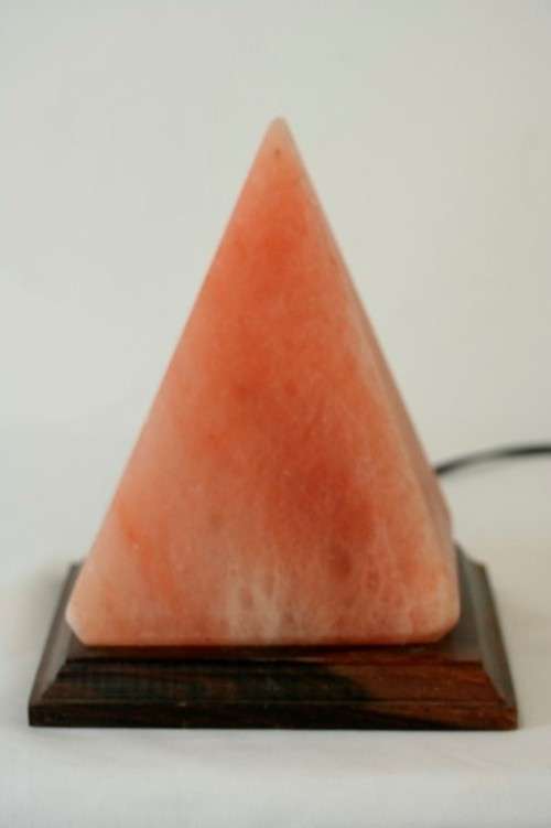 An incredible "Pyramid" Himalayan Crystal Salt lamp on a wooden base in complete working condition
