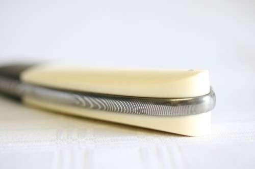 A beautifully made original Willie Paulsen Warthog Ivory-handle knife with Damascus steel blade!!