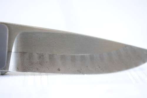 A beautifully made original Willie Paulsen Warthog Ivory-handle knife with Damascus steel blade!!