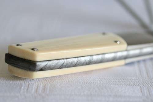 A magnificent handmade original Corrie Schoeman Ivory-handle knife with Damascus steel blade!!