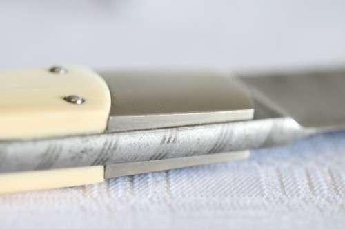 A magnificent handmade original Corrie Schoeman Ivory-handle knife with Damascus steel blade!!