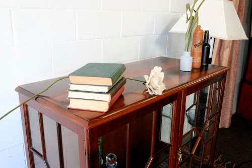 A beautiful vintage Imbuia ball and claw double door show-cabinet with two drawers & glass shelf.