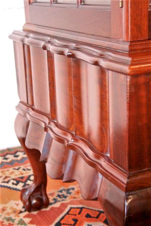 A beautiful vintage Imbuia ball and claw double door show-cabinet with two drawers & glass shelf.