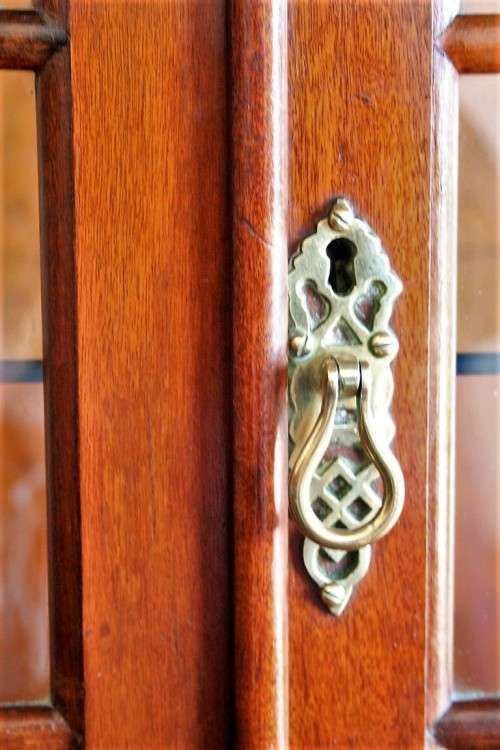 A beautiful vintage Imbuia ball and claw double door show-cabinet with two drawers & glass shelf.