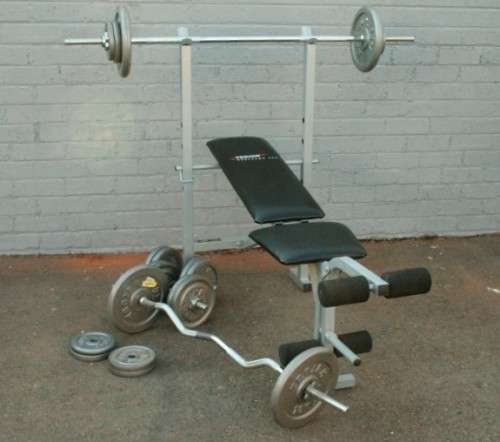 A fantastic original Trojan Performa 300 bench assorted weights in awesome condition