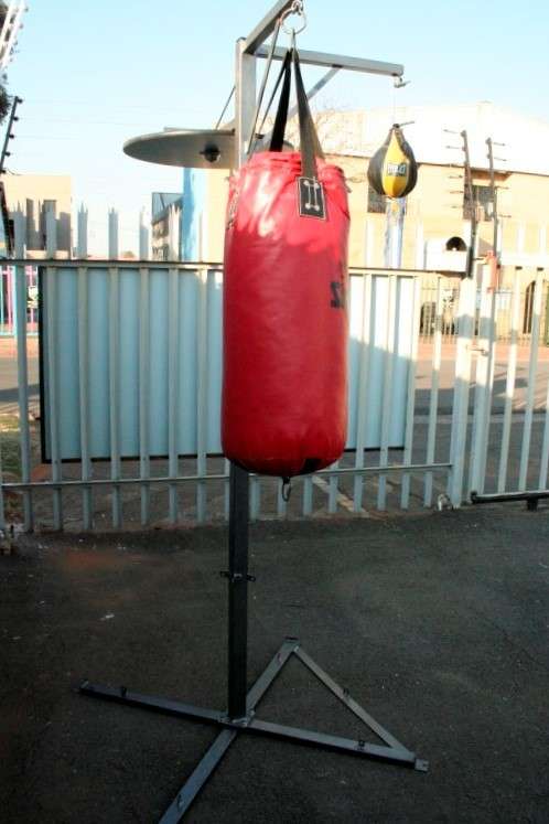 A well made steel boxing stand with a "SNT" punching bag and an "Everlast" speed bag = for home use!
