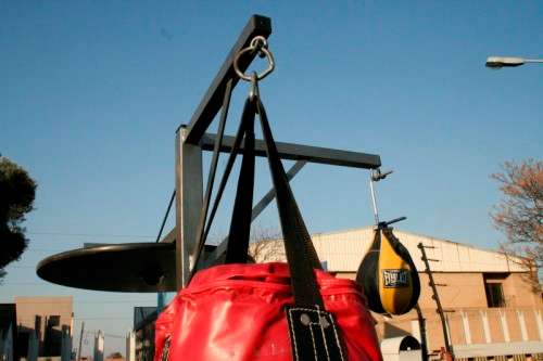 A well made steel boxing stand with a "SNT" punching bag and an "Everlast" speed bag = for home use!