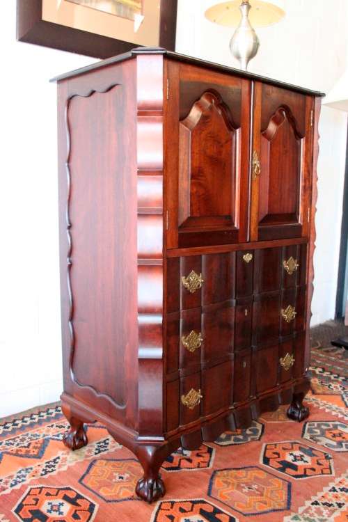 A beautiful vintage ball and claw "Tallboy" multi-purpose cabinet with 3 drawers and scalloped edges