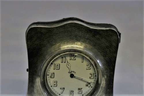 A spectacularly rare antique (1911) Hallmarked sterling silver travel clock w/ a Brevet 33236 watch